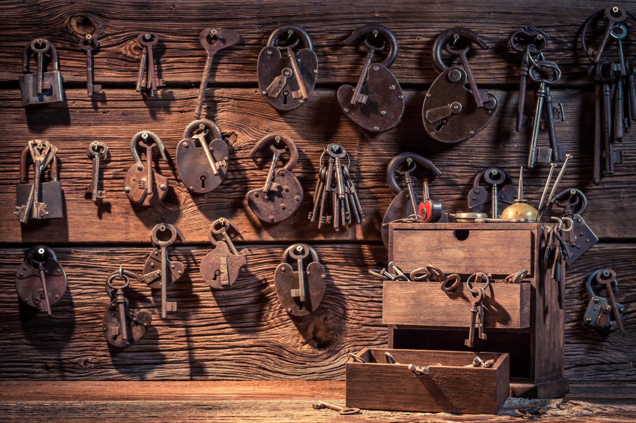 Wall of old keys and padlocks in a locksmith workshop